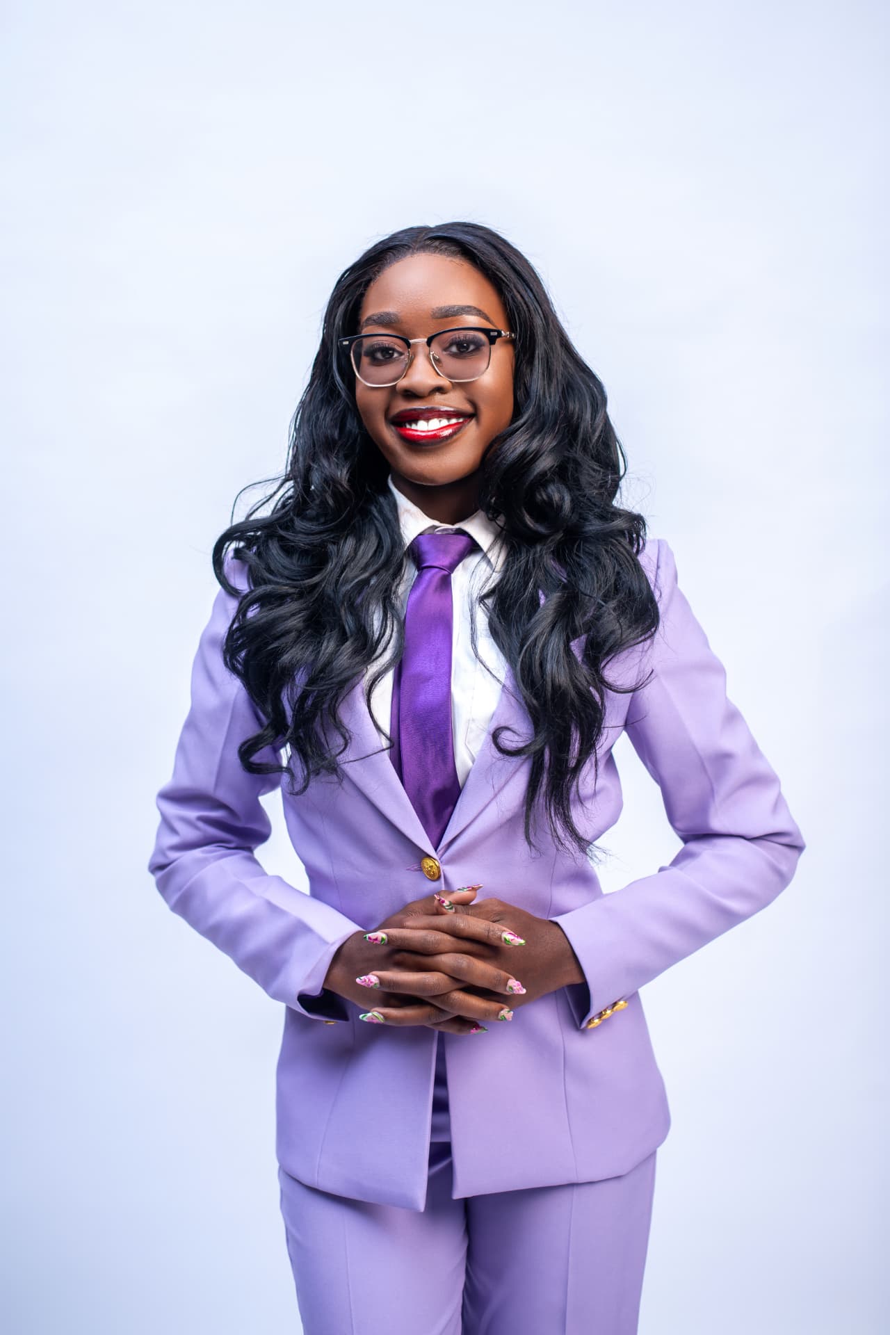 Shania Omollo in a lilac suit